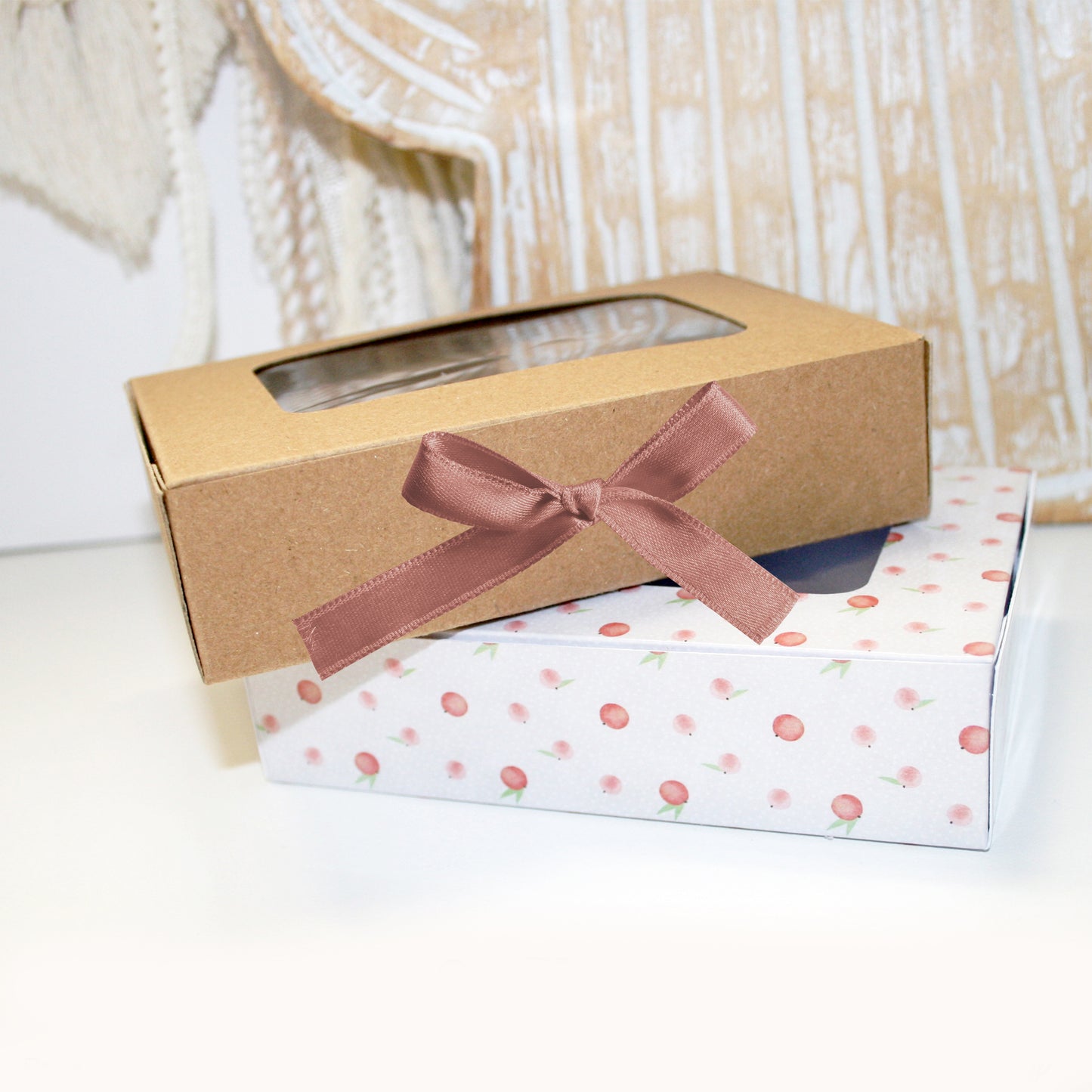 Gift box with a ribbon on a white surface