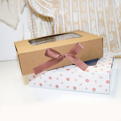 Gift box with a ribbon on a white surface