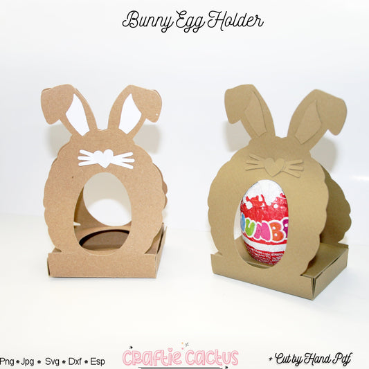 Two cardboard bunny egg holders on a white background with one holding a colorful Easter egg.