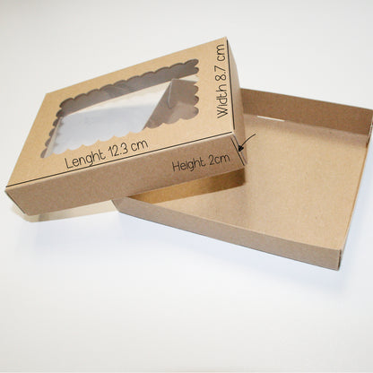 Brown cardboard box with measurements on a white background