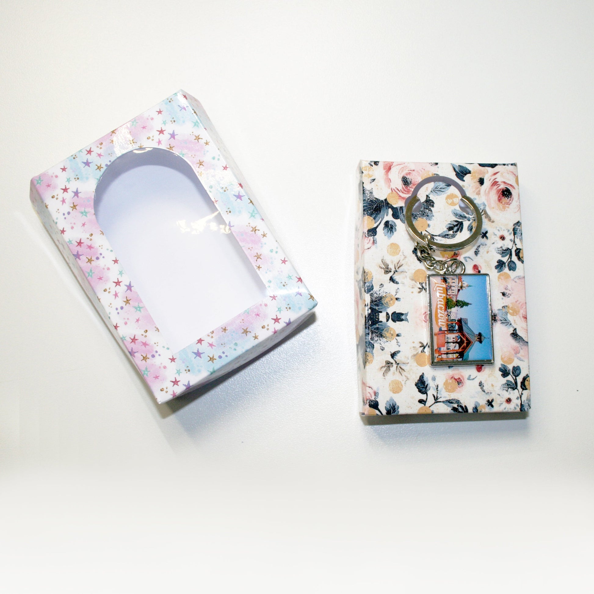 Two decorative boxes with floral patterns on a white background
